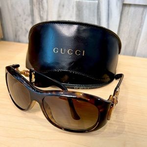 Women’s vintage Gucci sunglasses with leather case